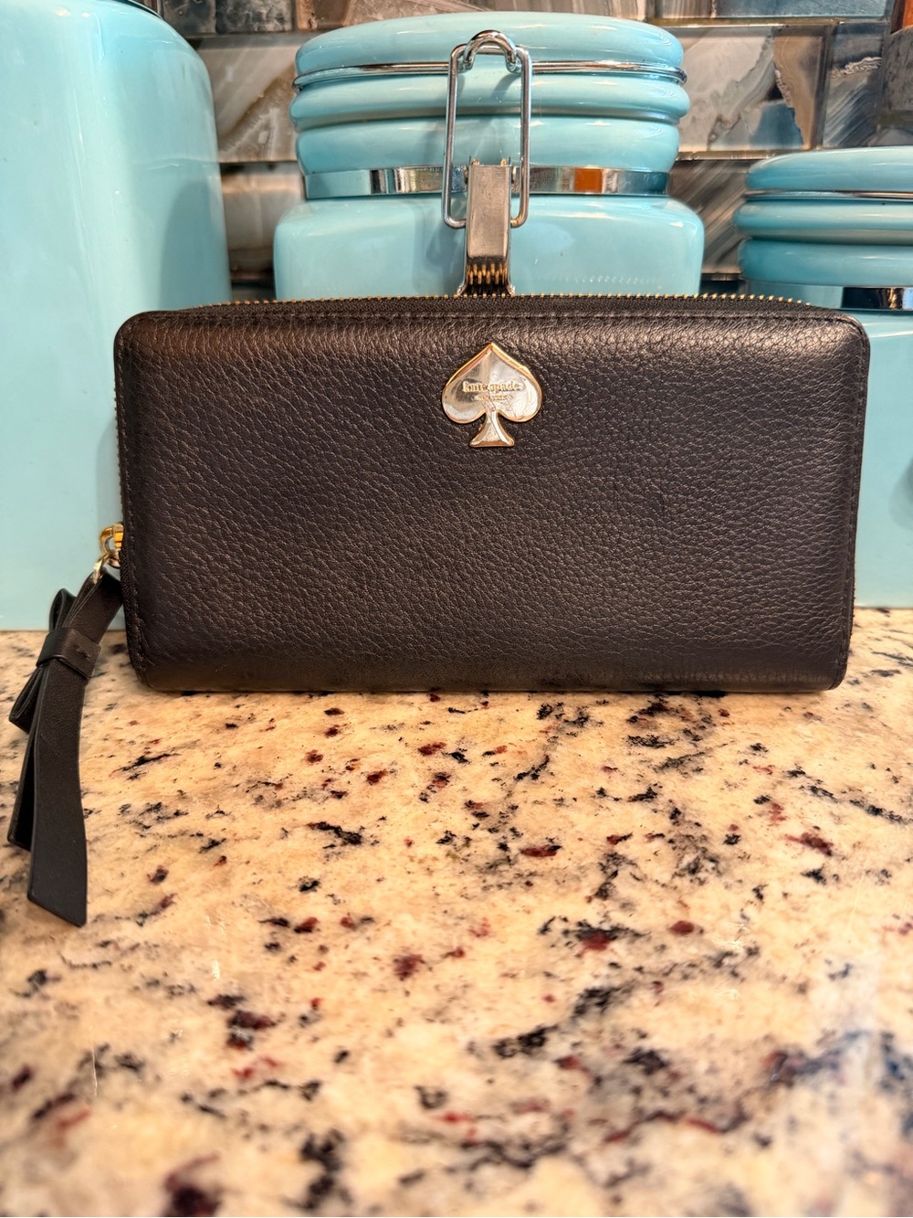 kate spade black pebbled leather zip-around wallet with spade emblem